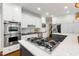 Gourmet kitchen features stainless steel appliances and a gas cooktop at 129 Trellingwood Dr, Morrisville, NC 27560