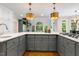 Spacious kitchen with island, stainless steel appliances and open floor plan at 129 Trellingwood Dr, Morrisville, NC 27560