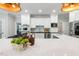 Gourmet kitchen features stainless steel appliances, an island and modern decor at 129 Trellingwood Dr, Morrisville, NC 27560