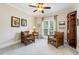 Comfortable living room with a window view and two leather armchairs at 129 Trellingwood Dr, Morrisville, NC 27560