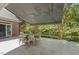 Enjoy outdoor living on this covered patio, surrounded by lush landscaping at 129 Trellingwood Dr, Morrisville, NC 27560