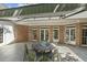 Enjoy entertaining on this covered patio with outdoor seating at 129 Trellingwood Dr, Morrisville, NC 27560