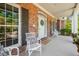 Welcoming front porch with white furniture, adorned with a wreath and a welcome mat at 129 Trellingwood Dr, Morrisville, NC 27560