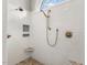 Shower featuring rain head and hand held fixtures, tiled walls, and a corner seat at 129 Trellingwood Dr, Morrisville, NC 27560