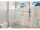 Walk-in shower with subway tiles, overhead window, and glass enclosure at 129 Trellingwood Dr, Morrisville, NC 27560