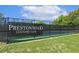 View of Prestonwood Country Club tennis courts behind a banner with well maintained grass at 129 Trellingwood Dr, Morrisville, NC 27560