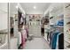 Well-organized walk-in closet with built-in shelving and drawers for ample storage at 129 Trellingwood Dr, Morrisville, NC 27560