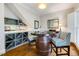 Inviting wine room features a barrel table, custom storage, and elegant decor for a sophisticated tasting experience at 129 Trellingwood Dr, Morrisville, NC 27560