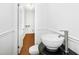 Stylish half-bath featuring a bowl sink, modern faucet, and wainscoting at 1415 Clearwater Dr, Sanford, NC 27330