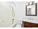 Traditional bathroom featuring a marble vanity, shower-tub combo, and elegant fixtures at 1415 Clearwater Dr, Sanford, NC 27330