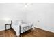 Bright, minimalist bedroom with wood floors, a wrought iron bed, and white walls at 1415 Clearwater Dr, Sanford, NC 27330