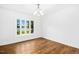 Bright dining room featuring a bay window, hardwood floors, and white walls, offering a clean and inviting space at 1415 Clearwater Dr, Sanford, NC 27330