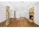 Spacious living room featuring hardwood floors, a stone fireplace, and access to multiple rooms at 1415 Clearwater Dr, Sanford, NC 27330
