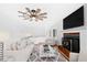 Bright living room featuring a cozy fireplace, modern ceiling fan, and stylish decor, creating an inviting atmosphere at 1415 Clearwater Dr, Sanford, NC 27330