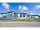 Modern building exterior with sleek design, large windows, and landscaped grounds at 1428 Goldfinch Perch Ln, Knightdale, NC 27545
