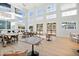 Bright dining area with large windows, ample seating, and modern decor at 1428 Goldfinch Perch Ln, Knightdale, NC 27545