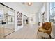 Bright hallway with glass-enclosed offices and unique artwork at 1428 Goldfinch Perch Ln, Knightdale, NC 27545