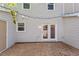 Backyard with gray vinyl siding and double doors that lead to the backyard at 1442 Aversboro Rd # 7, Garner, NC 27529