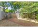 Backyard featuring brick patio area and a wood fence at 1442 Aversboro Rd # 7, Garner, NC 27529