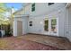 This backyard features a brick patio and manicured landscaping at 1442 Aversboro Rd # 7, Garner, NC 27529