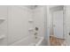 Bathroom with tub-shower combo featuring a shower caddy and gold fixtures at 1442 Aversboro Rd # 7, Garner, NC 27529