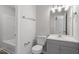 This modern bathroom features a white vanity, updated fixtures, and stylish decor at 1442 Aversboro Rd # 7, Garner, NC 27529