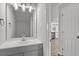 Bathroom features a modern vanity with a sleek countertop, stylish lighting fixtures, and modern hardware at 1442 Aversboro Rd # 7, Garner, NC 27529