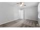 Bedroom with neutral walls, carpet, ceiling fan, and natural light, featuring an ensuite bathroom at 1442 Aversboro Rd # 7, Garner, NC 27529