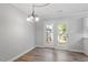 Dining room featuring hardwood floors, a chandelier and sliding glass doors at 1442 Aversboro Rd # 7, Garner, NC 27529