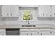 Bright kitchen features white cabinets, stainless appliances, granite countertops, and wood-look flooring at 1442 Aversboro Rd # 7, Garner, NC 27529