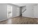 Bright living room with hardwood floors and stairs leading to the second floor at 1442 Aversboro Rd # 7, Garner, NC 27529