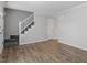 Bright living room with hardwood floors and stairs at 1442 Aversboro Rd # 7, Garner, NC 27529