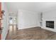 Bright, open living room with fireplace and wood-look floors at 1442 Aversboro Rd # 7, Garner, NC 27529