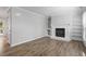 Living room featuring wood-look floors, fireplace, and neutral walls at 1442 Aversboro Rd # 7, Garner, NC 27529