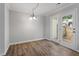 Living room features wood flooring and sliding doors to the patio at 1442 Aversboro Rd # 7, Garner, NC 27529