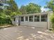 Charming backyard with a wooden deck and sunroom, perfect for outdoor entertaining at 1521 N Duke St, Durham, NC 27701