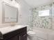 Full bathroom with vanity, mosaic tile, and shower over tub with unique tile surround at 1521 N Duke St, Durham, NC 27701
