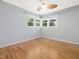 Bright bedroom features hardwood floors, neutral walls, and a ceiling fan for comfortable living at 1521 N Duke St, Durham, NC 27701