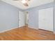 Comfortable bedroom features hardwood floors, neutral paint, a closet, and easy access to the bathroom at 1521 N Duke St, Durham, NC 27701