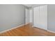 Bedroom with hardwood floors, closet, and neutral-toned walls offers a serene and relaxing space at 1521 N Duke St, Durham, NC 27701