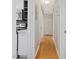 A clean hallway leading from the kitchen with hardwood floors and neutral walls at 1521 N Duke St, Durham, NC 27701