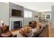 Spacious living room featuring a fireplace, hardwood floors, and cozy seating arrangement at 1521 N Duke St, Durham, NC 27701