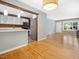 Open living space showcasing modern kitchen finishes, hardwood floors and natural light at 1521 N Duke St, Durham, NC 27701