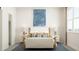 Comfortable bedroom with stylish accents, a wooden bed frame, and bright artwork at 1581 Goldfinch Perch Ln, Knightdale, NC 27545