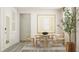 Bright dining room features a round table with seating for four at 1581 Goldfinch Perch Ln, Knightdale, NC 27545