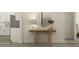 Inviting hallway with view of staircase and an entryway table with decor at 1581 Goldfinch Perch Ln, Knightdale, NC 27545