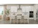 Bright, open kitchen featuring an island with counter seating, stainless appliances, and subway tile backsplash at 1581 Goldfinch Perch Ln, Knightdale, NC 27545