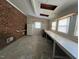 Bonus room with exposed brick and lots of windows at 167 Chic Ennis Rd, Coats, NC 27521