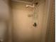Shower with a detachable showerhead and shelving at 167 Chic Ennis Rd, Coats, NC 27521