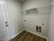 A spacious laundry room with vinyl flooring, a wire shelf, and easy access to plumbing at 167 Lotus Ave, Smithfield, NC 27577